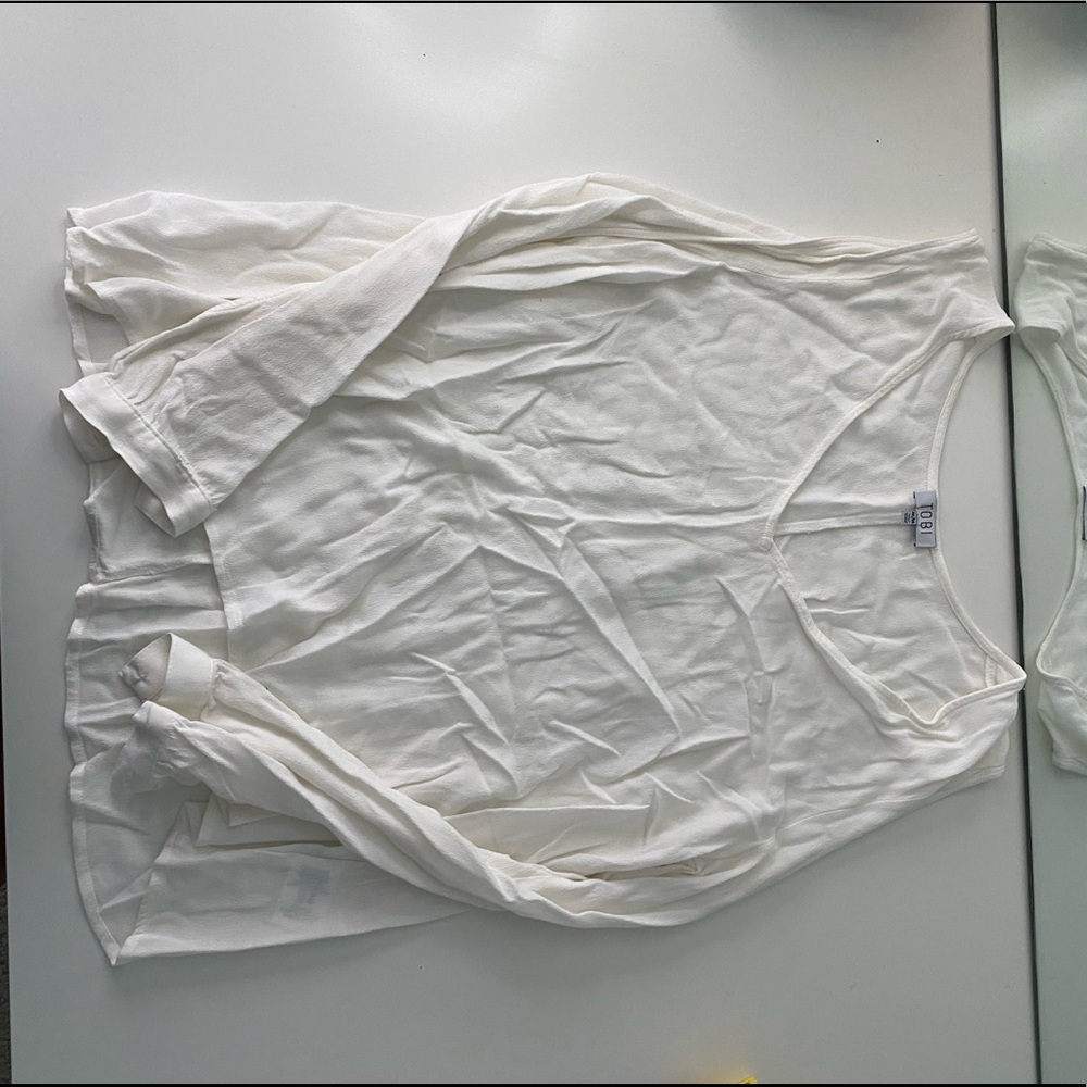 Long sleeve white top with arm cutouts